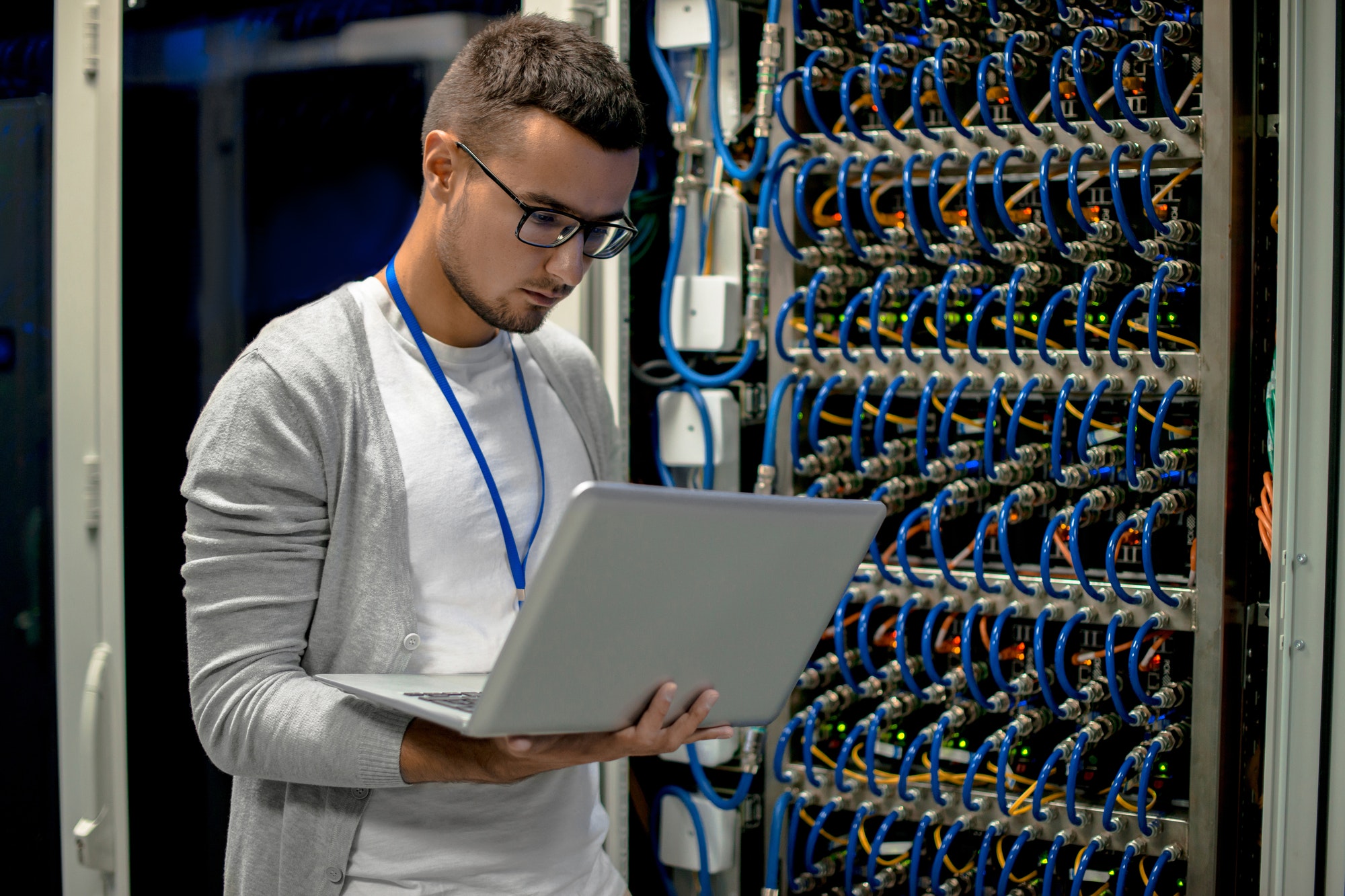 Young Engineer Managing Supercomputer Servers